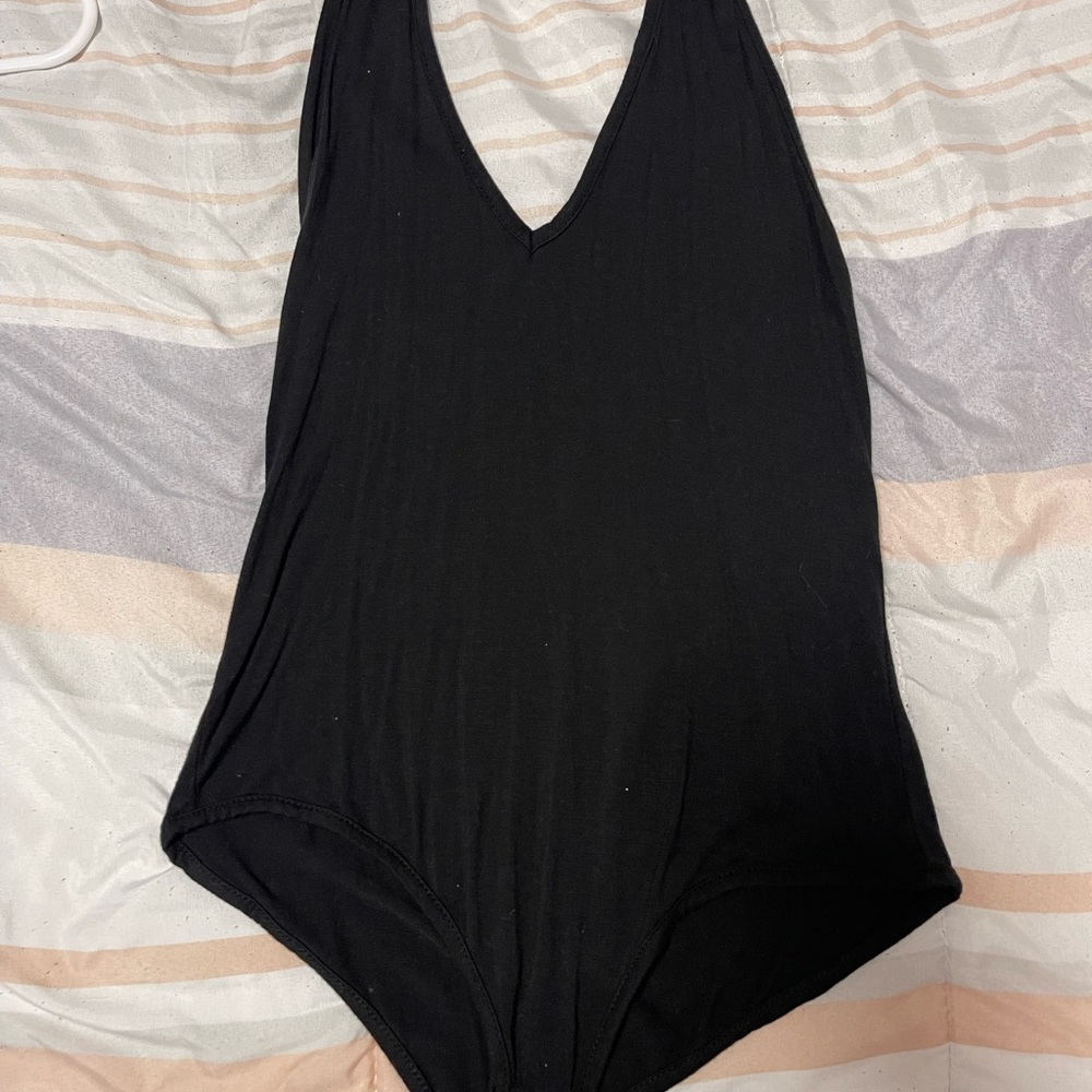 4 black bodysuits
